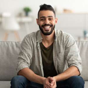 portrait of handsome young arab man smiling and lo 2022 12 16 09 05 59 utc 1